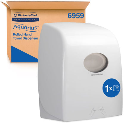 Der Aquarius™ Rollenhandtuchspender - Weiß von Kimberly-Clark GmbH steht vor seiner braunen Verpackungsbox mit Marken- und Produktdetails. Der hygienische Spender mit transparenter Front ist ideal für öffentliche Bereiche geeignet.