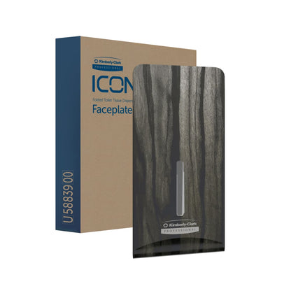 Eine braune Schachtel mit der Aufschrift "Kimberly-Clark Professional™ Icon™ Dispenser Faceplate - FTT" steht neben einer dunklen, holzstrukturierten Faceplate (27,80 x 13,10 x 1,40 cm) mit dem Logo der Kimberly-Clark GmbH - ideal für modernes Waschraumdesign.