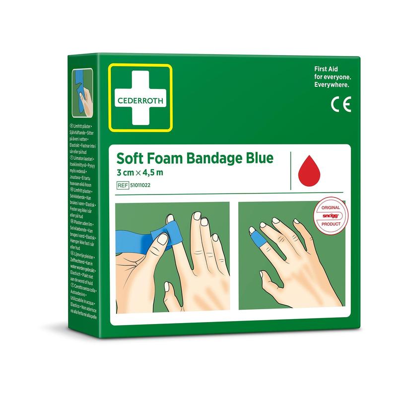 Zelené balení "Cederroth soft foam binde blau 3x450cm" od Orkla Wound Care AB zobrazuje ruce, které aplikují modrou bandáž. Balení zobrazuje červený symbol kapky a uvádí velikost 3 cm x 4,5 m (1 kus).