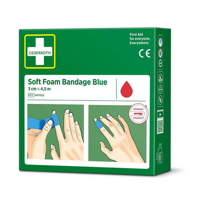 Zelená krabička Orkla Wound Care AB Cederroth soft foam binde blau 3x450cm (1 kus) zobrazuje na přední straně obrázky rukou, které aplikují modrou bandáž, a na straně jsou zobrazeny lékařské symboly.