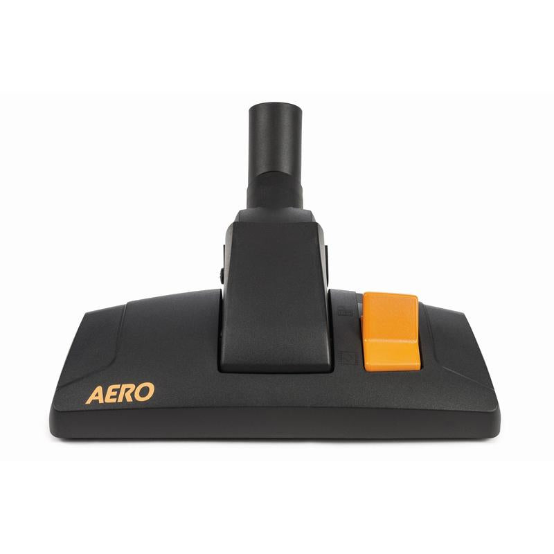 Černá podlahová hubice TASKI AERO Kombi-Rollendüse 32 mm od Diversey Deutschland GmbH & Co. OHG, s žlutým "TASKI AERO" na levé straně a velkým oranžovým tlačítkem na pravé straně, zobrazená na bílém pozadí.
