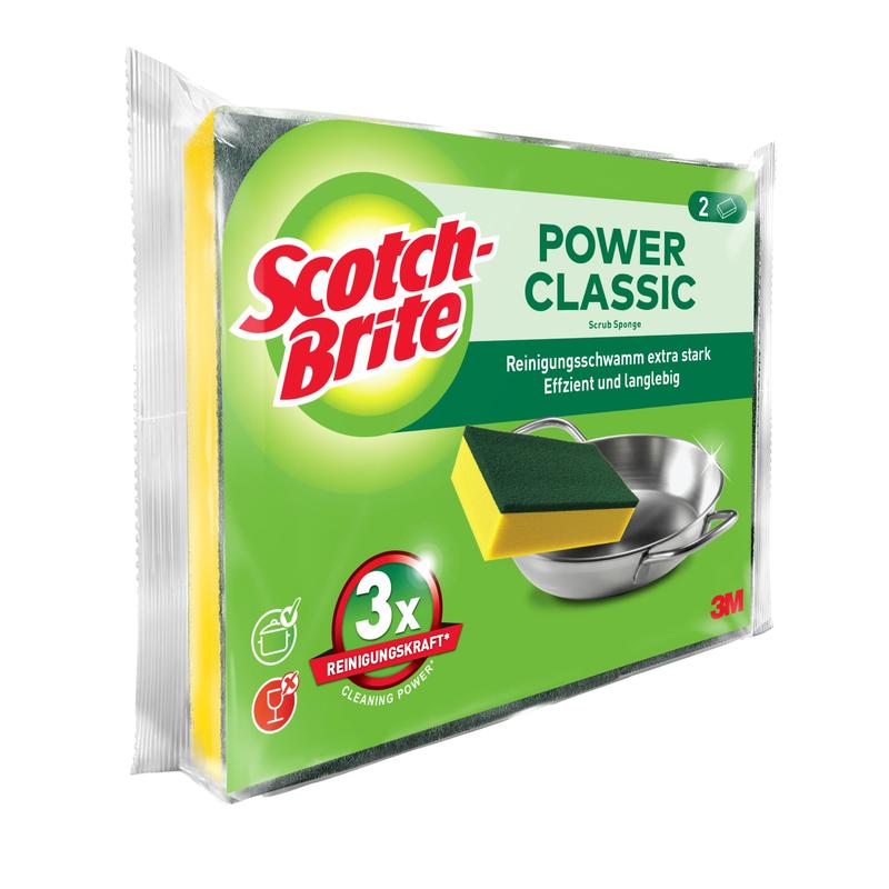Zobrazeno je balení čisticí houbičky 3M Deutschland GmbH Scotch-Brite® Classic se dvěma houbičkami. Na převážně zeleném obalu je zobrazená houbička a kovový hrnec, spolu s anglickým a německým textem.