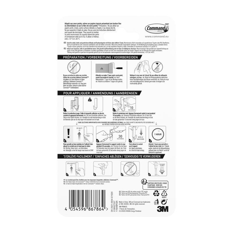 Zadní strana středně velkého matně černého háčku Command™ 17034B od 3M Deutschland GmbH ukazuje vícejazyčný návod s diagramy pro použití a odstranění, symboly kroků a čárovým kódem; obsahuje 1 háček a 2 proužky.