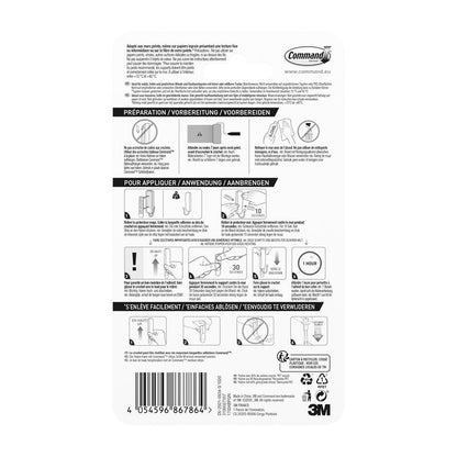 Zadní strana středně velkého matně černého háčku Command™ 17034B od 3M Deutschland GmbH ukazuje vícejazyčný návod s diagramy pro použití a odstranění, symboly kroků a čárovým kódem; obsahuje 1 háček a 2 proužky.