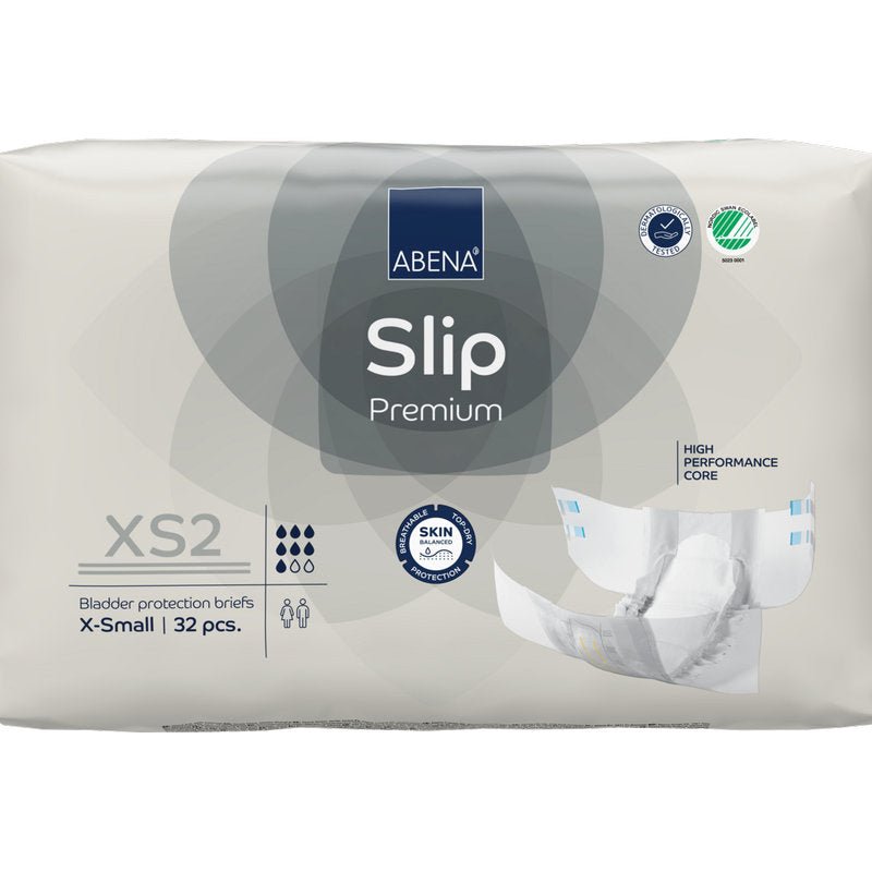 Balení 32 kusů ABENA Slip Premium od Abena Re-Seller GmbH ve velikosti XS2 X-Small v béžovém balení s certifikacemi "High Performance Core" a "Skin Friendly" pro spolehlivou inkontinenční péči.
