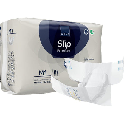 Zobrazeno je balení s nápisem "ABENA Slip Premium" od Abena Re-Seller GmbH s rozloženou plenkou v popředí. Balení obsahuje 26 středně velkých kusů pro spolehlivou inkontinenční péči.