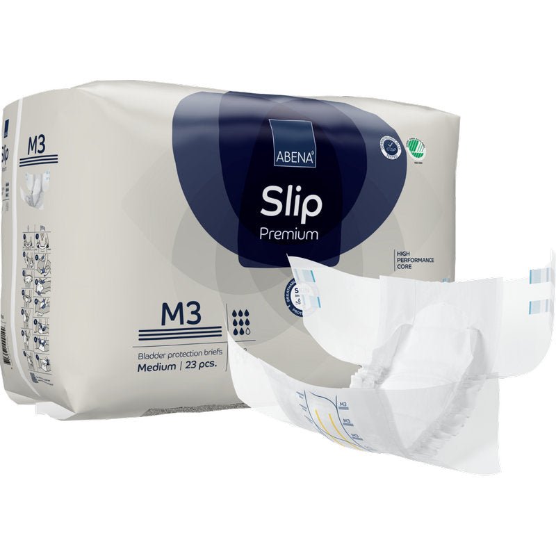 Zobrazeno je balení ABENA Slip Premium od Abena Re-Seller GmbH s jedním středním slipem mimo balení. Balení obsahuje 23 slipů pro spolehlivou inkontinenční péči.