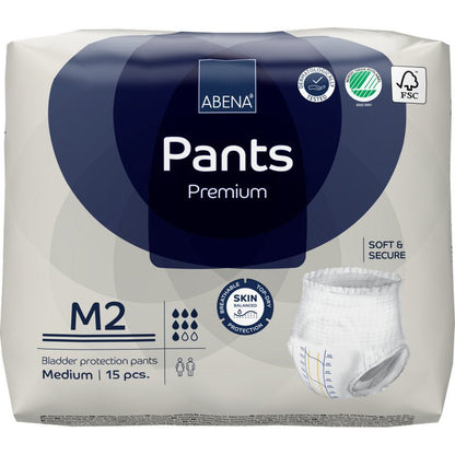 Balení 15 ks ABENA Pants Premium M od Abena Re-Seller GmbH. Bílo-modrý obal zobrazuje ikony pro vysokou savost, ochranu pokožky, savost a ekologickou certifikaci.