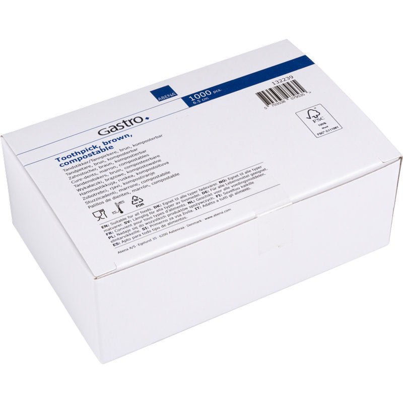 Bílá kartonová krabice s nápisem "Zubní párátka, 65 mm, Nezabalené, Dřevo | Balení (1000 ks)" od společnosti Abena Re-Seller GmbH s informacemi o produktu, symboly a čárovým kódem na modro-bílém štítku.