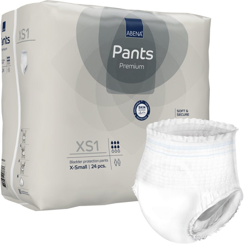 Na obrázku je balení 24 ks ABENA Pants XS1, Premium od Abena Re-Seller GmbH (velikost X-Small, natahovací pleny pro dospělé), přičemž jedna bílá plena je mimo obal opatřena informacemi o produktu a symboly.