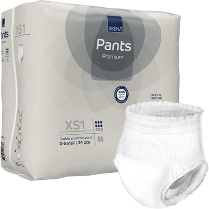 Na obrázku je balení 24 ks ABENA Pants XS1, Premium od Abena Re-Seller GmbH (velikost X-Small, natahovací pleny pro dospělé), přičemž jedna bílá plena je mimo obal opatřena informacemi o produktu a symboly.