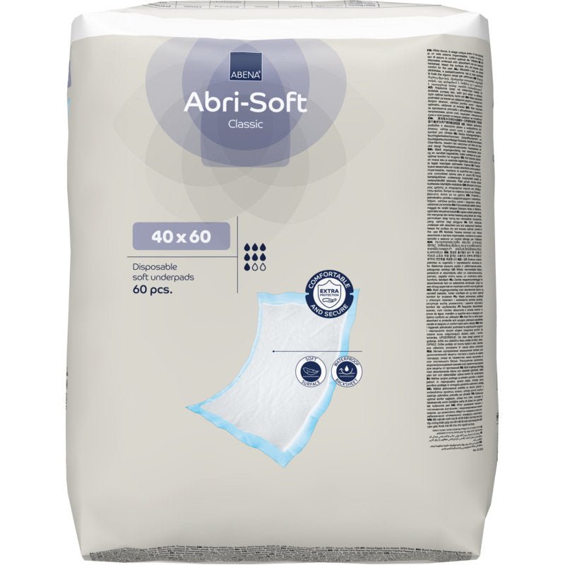 Balení jednorázových podložek Abri-Soft Classic, 40x60 cm, modrá (60 kusů) od Abena Re-Seller GmbH. Na obalu jsou zobrazeny detaily produktu, symboly a náčrt podložky.