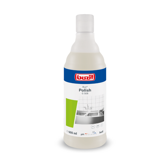 Eine 600 ml Flasche Buzil Buz® Polish G 508 Gebrauchsfertige Scheuermilch, aufrecht stehend. Das Etikett zeigt ein blau-weißes Design mit grünen Akzenten und das Bild einer gefliesten Oberfläche, was die Wirksamkeit bei der Oberflächenreinigung hervorhebt. Das Markenlogo der BUZIL-WERK Wagner GmbH & Co. KG ist oben prominent angebracht.