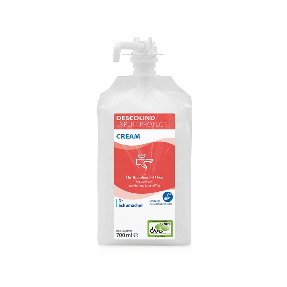 700ml doplňovací sáček Dr. Schumacher DESCOLIND EXPERT PROTECT CREAM s bílou tkaninou a červeno-bílou etiketou s informacemi o produktu a modrým brandingem Dr. Schumacher GmbH pro profesionální ochranu pokožky.