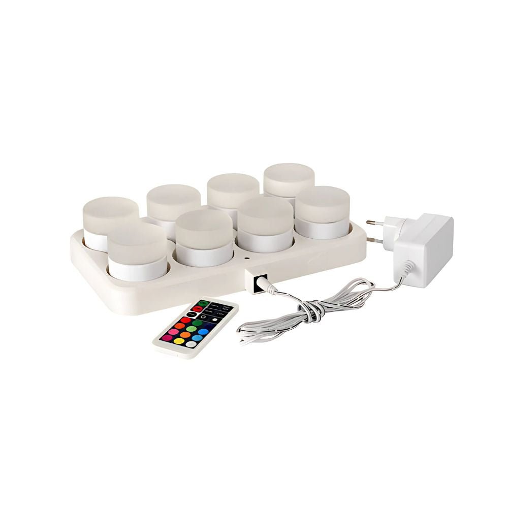 Sada Duni GmbH Multicolour LED, Mini (8 kusů) se skládá z osmi mini LED světel pro kreativní osvětlení, včetně dálkového ovládání a síťového adaptéru, vše na jednoduchém bílém pozadí.