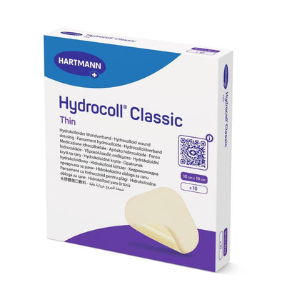 Balení sterilních obvazů Hartmann Hydrocoll® Classic Thin, jednotlivě zatavené od Paul Hartmann AG, obsahuje 10 kusů (10 cm x 10 cm) s logem značky a částečným obrázkem béžového obvazu pro vlhké hojení ran.