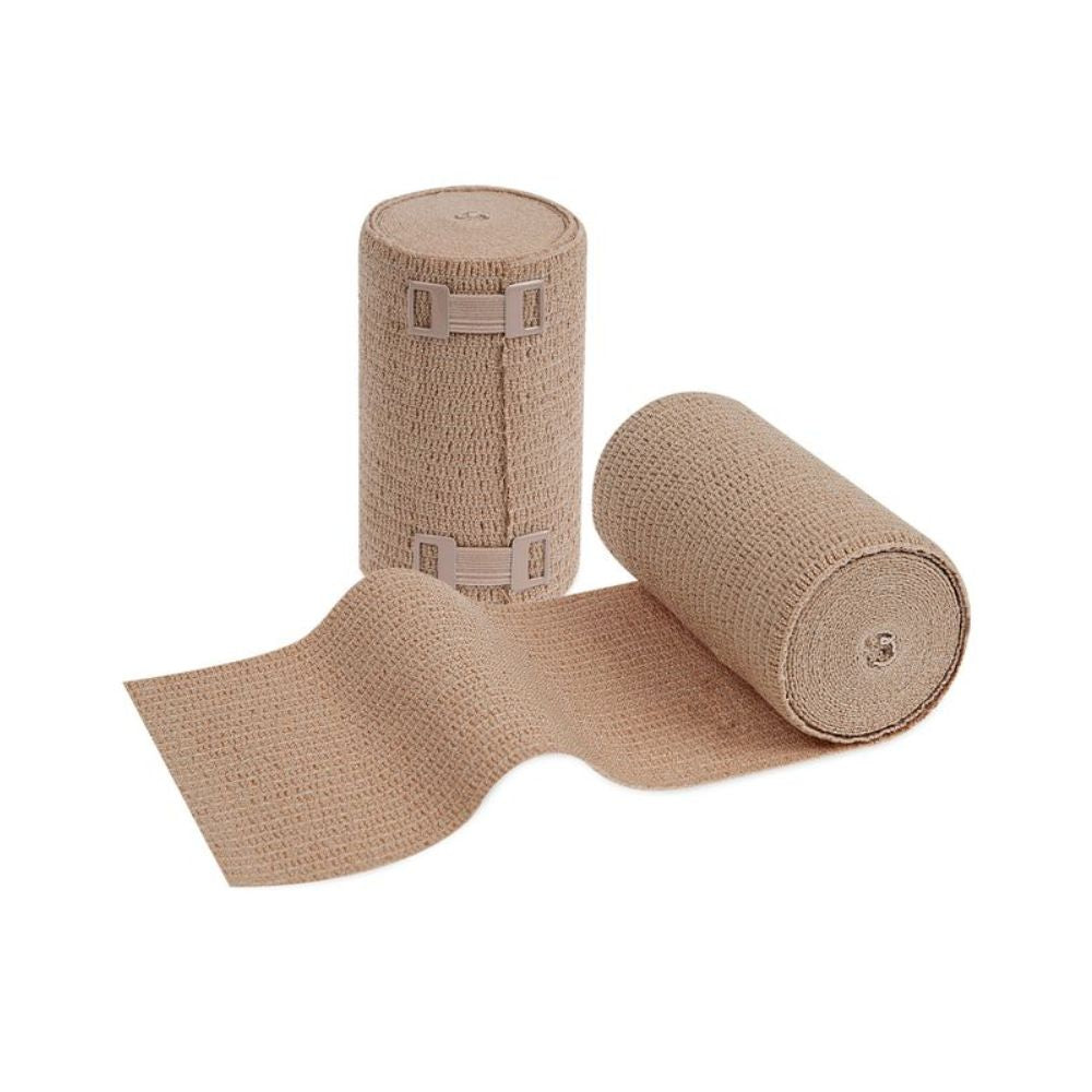 Vystaveny jsou dvě role Meditrade ABE Ven® silně elastického dlouhého obvazu; jedna stojí vzpřímeně a jedna je částečně odvinutá, takže je viditelná textura. Na vzpřímeně stojící roli jsou vidět kovové spony pro fixaci obvazu, které zajišťují optimální přizpůsobení při žilních a lymfatických onemocněních.