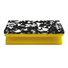 Houba Arcora PU-PAD (150 x 70 x 45 mm) od společnosti Arcora International GmbH má žlutou základnu z PU pěny a černo-bíle mramorovaný drsný povrch; k dispozici v balení po 10 kusech, zobrazené na bílém pozadí.