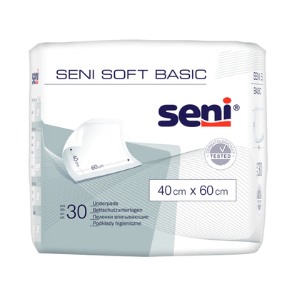 Balení 30 kusů Seni Soft Basic podložek na ochranu postele (různé velikosti) od společnosti TZMO Deutschland GmbH v bílém obalu s modrošedými akcenty poskytuje spolehlivou ochranu. Logo Seni a informace o produktu jsou jasně viditelné.