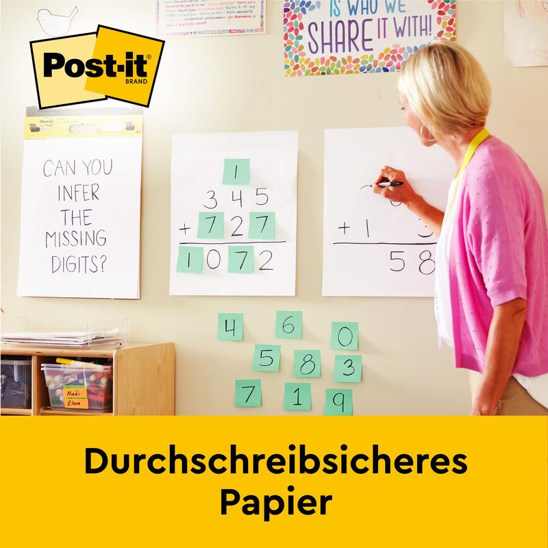 Žena píše matematickou rovnici na Post-it® Super Sticky samolepicí Mini Meeting Chart (38 x 45,7 cm) od 3M Deutschland GmbH, s "Průpisovým papírem" a logem značky Post-it na dolním okraji.